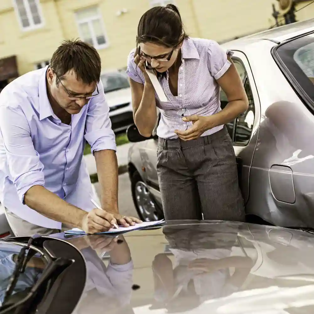 Two drivers exchanging information after an accident