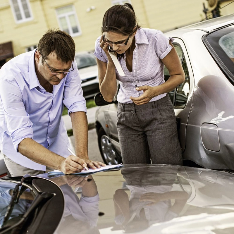 Two drivers exchanging information after an accident
