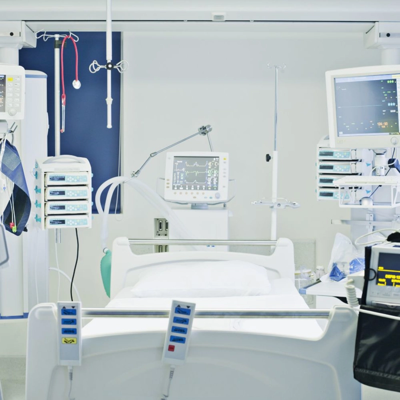 Empty hospital bed and equipment